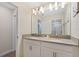 Bathroom with double vanity and large mirror at 820 Pebble Beach Dr, Davenport, FL 33896