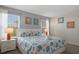 Bedroom with large bed, coastal theme, and two nightstands at 820 Pebble Beach Dr, Davenport, FL 33896