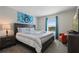 Bedroom with king-size bed, TV, and nightstand at 820 Pebble Beach Dr, Davenport, FL 33896