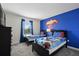 Twin bedroom with Superman theme and two beds at 820 Pebble Beach Dr, Davenport, FL 33896