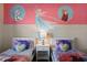 Twin bedroom with Frozen theme, two beds, and a nightstand at 820 Pebble Beach Dr, Davenport, FL 33896