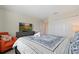 Bedroom with king-size bed, TV, and dresser at 820 Pebble Beach Dr, Davenport, FL 33896