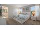 Main bedroom with king-size bed, ensuite bathroom access, and ocean decor at 820 Pebble Beach Dr, Davenport, FL 33896