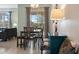 Bright dining room with table, bench seating, and access to the patio at 820 Pebble Beach Dr, Davenport, FL 33896