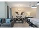 Dining area features a table with seating for six and a stylish light fixture at 820 Pebble Beach Dr, Davenport, FL 33896