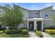 Modern 2-story townhome with attractive landscaping and a 2-car driveway at 820 Pebble Beach Dr, Davenport, FL 33896