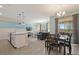 Open concept kitchen with island, stainless steel appliances, and breakfast bar at 820 Pebble Beach Dr, Davenport, FL 33896
