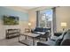 Living room features a large TV, comfy sofas, and a coffee table at 820 Pebble Beach Dr, Davenport, FL 33896