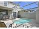 Private pool area with lounge chairs and a screened enclosure at 820 Pebble Beach Dr, Davenport, FL 33896