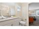 Clean bathroom with single vanity, toilet, and shower at 830 Pebble Beach Dr, Davenport, FL 33896