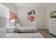 Wonder Personal themed bedroom with twin beds, nightstands, and a dresser at 830 Pebble Beach Dr, Davenport, FL 33896