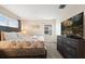 King-size bed, dresser, and large windows at 830 Pebble Beach Dr, Davenport, FL 33896