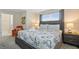 Spacious bedroom with king-size bed and ensuite bathroom access at 830 Pebble Beach Dr, Davenport, FL 33896