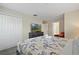 Bedroom with king-size bed, TV, and large closet at 830 Pebble Beach Dr, Davenport, FL 33896