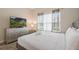 Spacious bedroom with king-size bed, dresser, and TV at 830 Pebble Beach Dr, Davenport, FL 33896