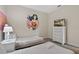 Wonder Personal themed bedroom with twin beds, nightstands, and a dresser at 830 Pebble Beach Dr, Davenport, FL 33896