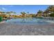 Resort-style pool with palm trees and lounge chairs at 830 Pebble Beach Dr, Davenport, FL 33896