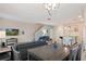 Open dining area connected to the kitchen and living room at 830 Pebble Beach Dr, Davenport, FL 33896