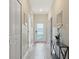 Bright and airy entryway with tile flooring and access to other rooms at 830 Pebble Beach Dr, Davenport, FL 33896