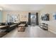 Spacious living area with comfortable seating and access to patio at 830 Pebble Beach Dr, Davenport, FL 33896