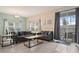 Spacious living area featuring a sofa, coffee table, and access to a patio at 830 Pebble Beach Dr, Davenport, FL 33896