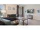 Bright living room with comfy sofas, a coffee table, and a large TV at 830 Pebble Beach Dr, Davenport, FL 33896
