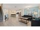 Open living space showcasing a kitchen, stairs, and comfortable seating at 830 Pebble Beach Dr, Davenport, FL 33896