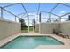 Private screened pool with lounge chair at 830 Pebble Beach Dr, Davenport, FL 33896