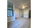 Bedroom with hardwood floors and large window at 911 N Orange Ave # 211, Orlando, FL 32801