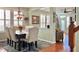Bright dining room features a spacious table, chandelier, and hardwood floors at 1133 Indigo Dr, Celebration, FL 34747