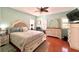 Spacious main bedroom with wood floors and a comfy bed at 1133 Indigo Dr, Celebration, FL 34747
