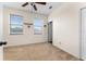 Spacious bedroom with ceiling fan, large windows, and ample closet space at 13228 Daniels Landing Cir, Winter Garden, FL 34787