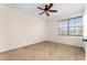 Spacious bedroom with carpeted floor, ceiling fan, and window with blinds at 13228 Daniels Landing Cir, Winter Garden, FL 34787