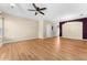 Open living area with hardwood floors and ceiling fan at 13228 Daniels Landing Cir, Winter Garden, FL 34787