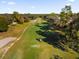 Drone view of a golf course with a golf cart on the fairway at 175 Golf Club Dr # 175, Longwood, FL 32779