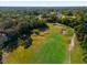 Aerial view of golf course with sand traps and green at 175 Golf Club Dr # 175, Longwood, FL 32779