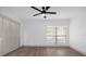 Well-lit bedroom with large closet and ceiling fan at 175 Golf Club Dr # 175, Longwood, FL 32779