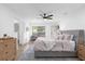 Spacious bedroom with a ceiling fan and large windows at 175 Golf Club Dr # 175, Longwood, FL 32779