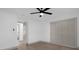 Bright bedroom with a closet and door to hallway at 175 Golf Club Dr # 175, Longwood, FL 32779