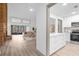 Modern kitchen with white cabinets, quartz countertops, and stainless steel appliances at 175 Golf Club Dr # 175, Longwood, FL 32779