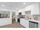 Modern white kitchen with stainless steel appliances at 175 Golf Club Dr # 175, Longwood, FL 32779