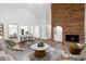 Living room features a brick fireplace, high ceilings and an open floor plan at 175 Golf Club Dr # 175, Longwood, FL 32779