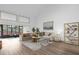 Open living space with large windows, comfortable seating and modern decor at 175 Golf Club Dr # 175, Longwood, FL 32779