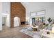 Spacious living room with a large brick fireplace and access to a private patio at 175 Golf Club Dr # 175, Longwood, FL 32779
