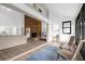 Sunlit living area with a view of the fireplace and access to a screened patio at 175 Golf Club Dr # 175, Longwood, FL 32779