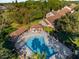 Community pool with lounge chairs and shaded seating areas at 175 Golf Club Dr # 175, Longwood, FL 32779