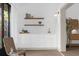 Modern wet bar with white shaker cabinets, quartz countertop and gold hardware at 175 Golf Club Dr # 175, Longwood, FL 32779