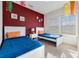 Bedroom with two twin beds, playfully decorated at 3212 Cupid Pl, Kissimmee, FL 34747