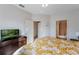 Bedroom with a king-size bed, en-suite bathroom, and access to upper floor at 3212 Cupid Pl, Kissimmee, FL 34747