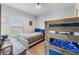 Bedroom with a full-size bed and built-in bunk bed at 3212 Cupid Pl, Kissimmee, FL 34747
